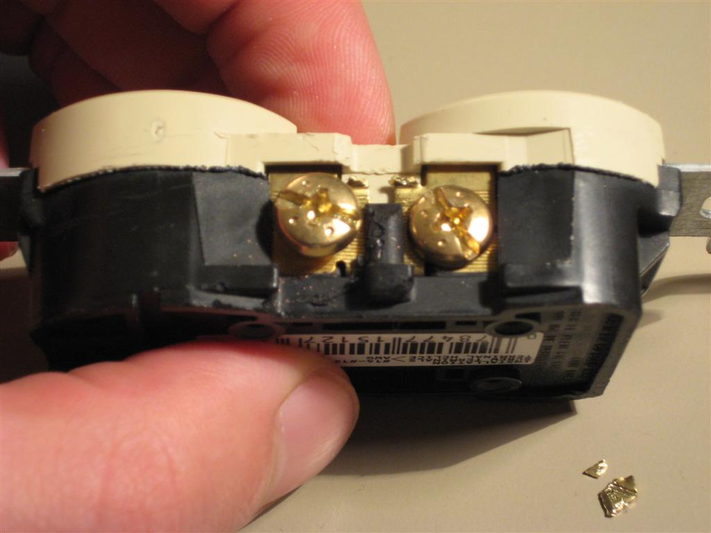 Outlet with tab cut