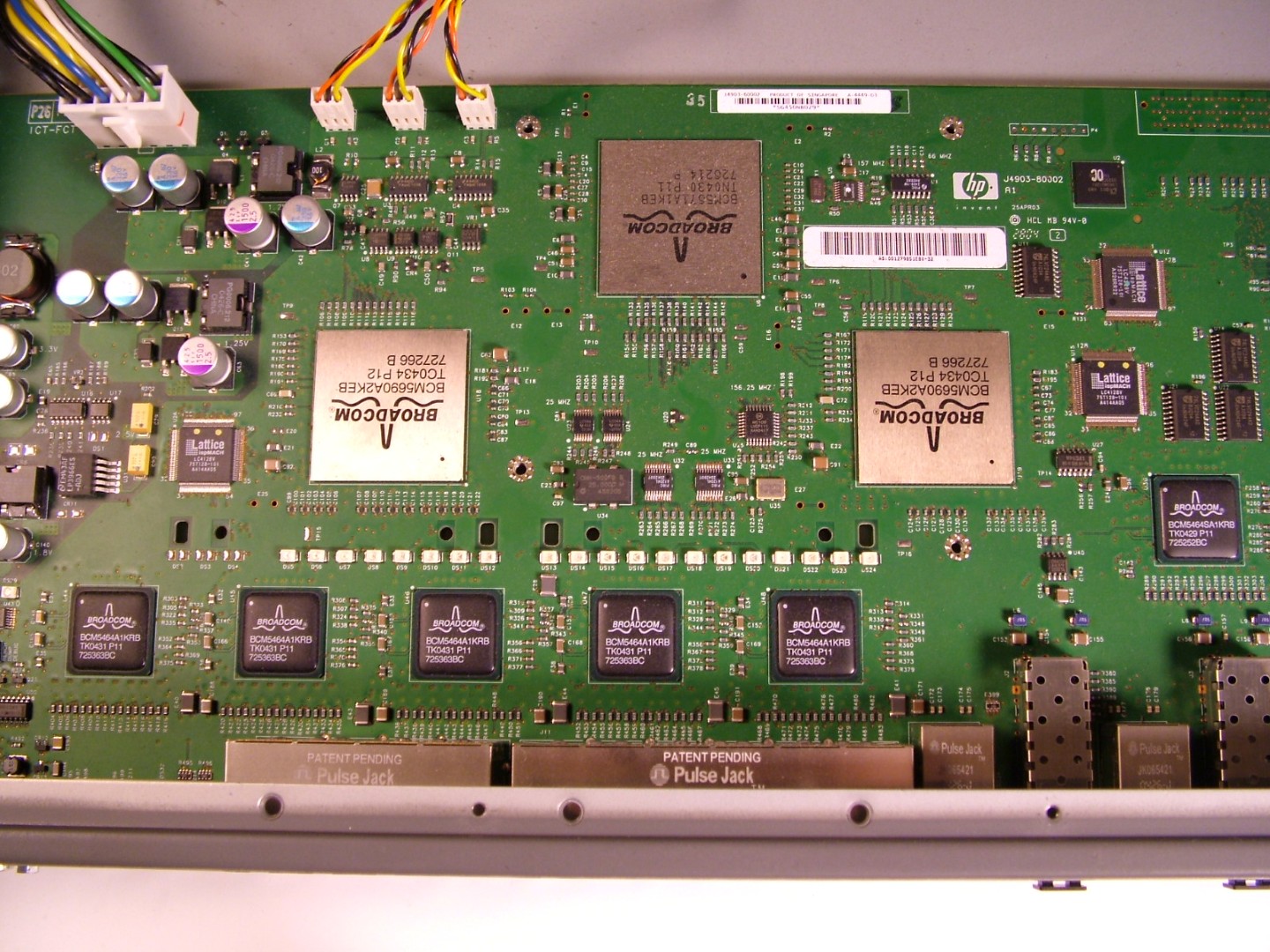 Bottom of motherboard showing Broadcom ASICs