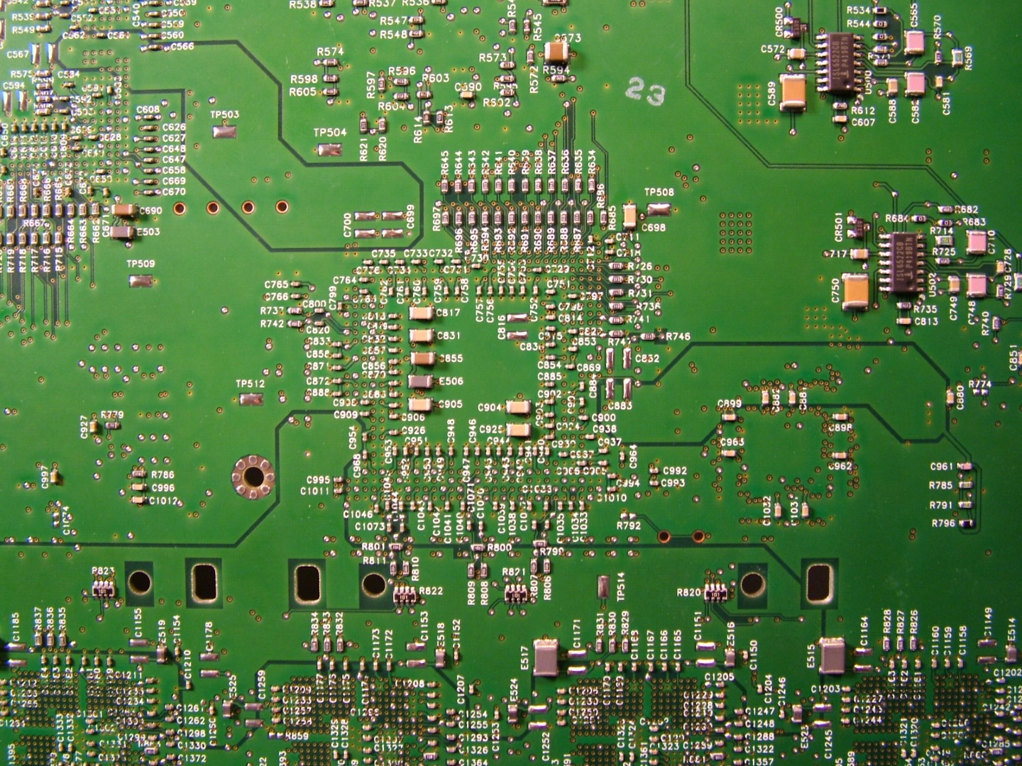 Back of the motherboard showing capacitors and ground plane